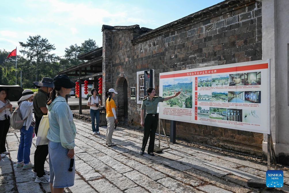 A docent briefs visitors on the history at a former Red Army hospital site in Chentang Village of Shibi Town in Ninghua County, southeast China's Fujian Province, Sept. 9, 2026. This year marks the 90th anniversary of the victory of the Long March by the Red Army under the leadership of the Communist Party of China (CPC). The former Red Army hospital site is located in Chentang Village, Ninghua County, one of the starting points of the Long March by the Central Red Army. (Xinhua/Zheng Huansong)