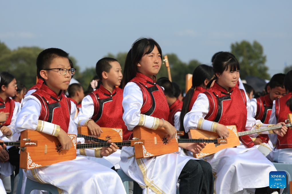 Performers play ethnic musical instruments during the opening ceremony of a Nadam fair in the Mongolian Autonomous County of Dorbod, Daqing City, northeast China's Heilongjiang Province, Sept. 6, 2026. The event was held here on Sunday. It featured cultural performances and folk activities, offering tourists and local residents a celebration of grassland culture. (Photo by Xu Shuai/Xinhua)