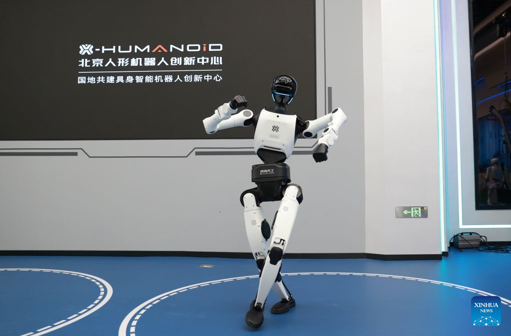 The humanoid robot Tiangong 3.0 dances at the Beijing Innovation Center of Humanoid Robotics in Beijing, capital of China, July 1, 2026. The Beijing Economic-Technological Development Area, also known as Beijing E-Town, has managed to cultivate and strengthen a modern system of emerging and forward-looking industries. (Photo by Ma Zihan/Xinhua)