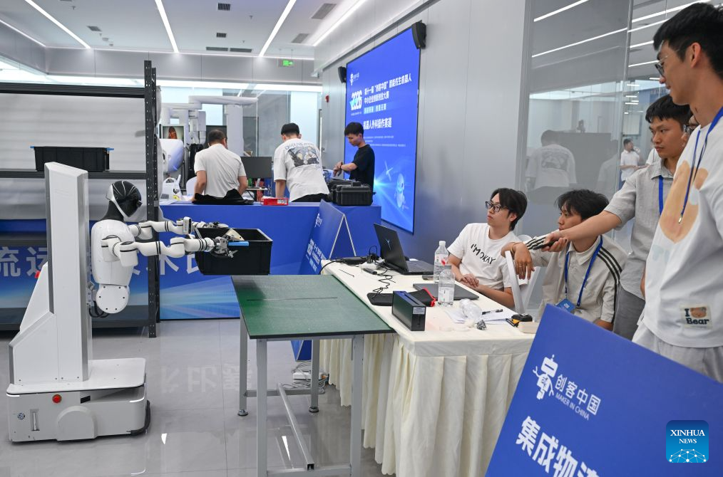 This photo taken on Sept. 9, 2026 shows integrated logistics operation technology competition during the final of the 11th Maker in China intelligent bionic robot innovation and entrepreneurship competition for small and medium-sized enterprises in Chongqing, southwest China. The final of the event kicked off in Chongqing on Wednesday, with the participation of some 100 teams from all over the country. This competition will last until Sept. 11. (Xinhua/Chen Cheng)