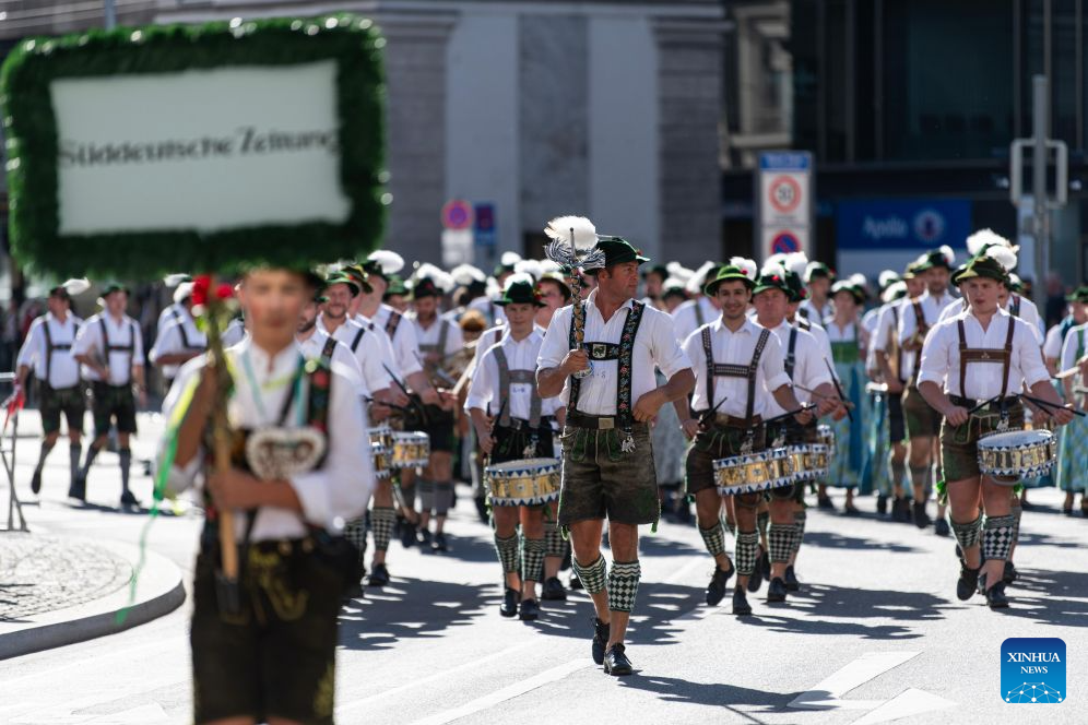 Musicians participate in the Oktoberfest parade in Munich, Germany, Sept. 20, 2026. The 191st Oktoberfest, one of the largest folk festivals in Germany, opened on Saturday in Munich, and will last until Oct. 4. (Xinhua/Zhang Haofu)