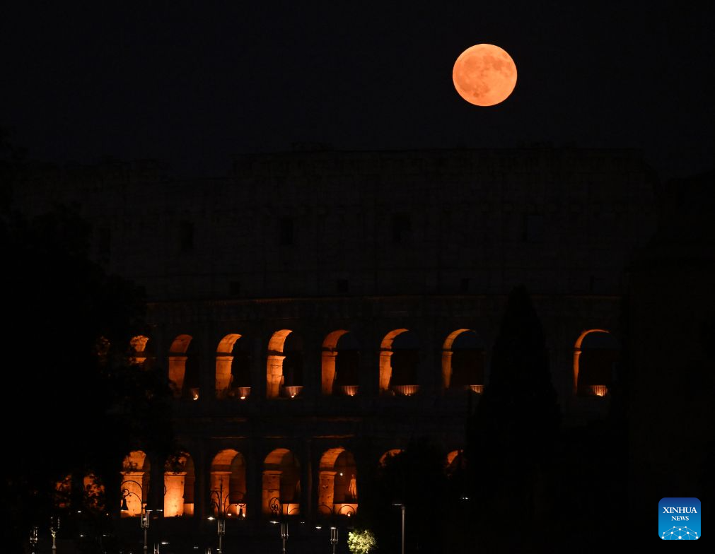 This photo taken on July 29, 2026 shows a full moon and the Colosseum in Rome, Italy. (Photo by Alberto Lingria/Xinhua)