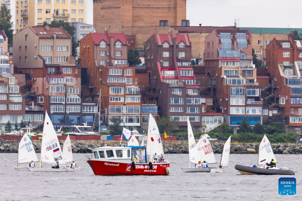 Sailboats are pictured during a parade of sails in Vladivostok, Russia, Sept. 1, 2026. A parade of sails was held during the 11th Eastern Economic Forum (EEF) on Tuesday, with more than 1,000 sailing enthusiasts participating. (Photo by Andrey Matveenko/Xinhua)