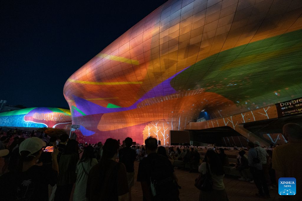 People watch a media art show during Seoul Light DDP 2026 Fall at Dongdaemun Design Plaza (DDP) in Seoul, South Korea, Sept. 8, 2026. The event runs from Sept. 3 to 13 under the theme K-Original Light. (Photo by Jun Hyosang/Xinhua)