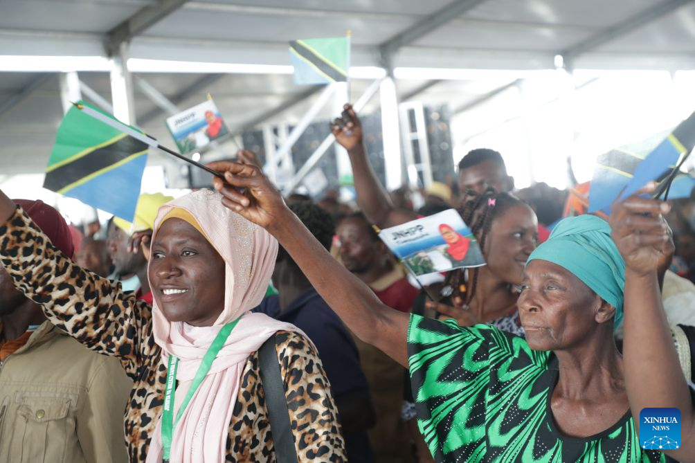 Local people wave flags to celebrate the inauguration of the Julius Nyerere Hydropower Plant in Coast Region, Tanzania, Aug. 22, 2026. Tanzanian President Samia Suluhu Hassan on Saturday inaugurated the 2,115-megawatt Julius Nyerere Hydropower Plant, a landmark project expected to strengthen electricity supply and accelerate industrial and economic development. (Xinhua/Emmanuel Herman)