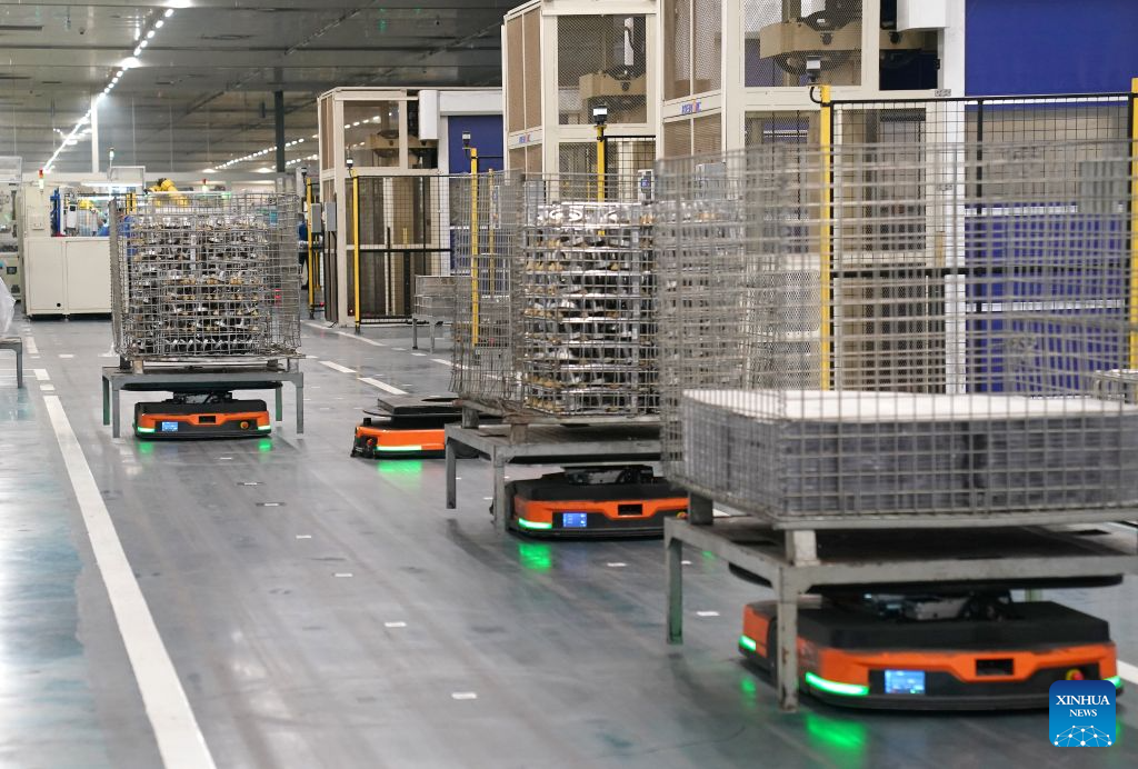 Automated guided vehicles are at work at Highly Group's production base in Nanchang, east China's Jiangxi Province, Aug. 20, 2026. Smart, digitalized production has been fully realized at the Nanchang production base of electric appliance manufacturer Highly Group, a leading intelligent manufacturing base for air conditioner compressors. On average, the base produces a compressor every 6.5 seconds. Highly Group exports air conditioner compressors to 165 countries and regions worldwide, accounting for nearly one-seventh of the global market share. (Xinhua/Wan Xiang)