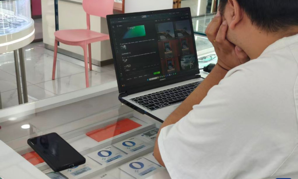 Chen Aijun makes AI videos in an optical shop in Chengdu, southwest China's Sichuan Province, Aug. 14, 2026. (Xinhua/Lu Youyi)