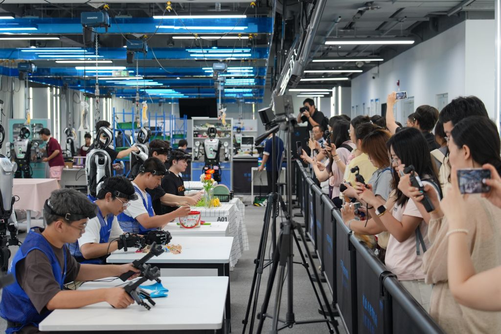 Journalists visit a humanoid robot data training center in Shijingshan District of Beijing, capital of China, Aug. 10, 2026. A press conference and a series of promotional events for the 2026 China International Fair for Trade in Services (CIFTIS) were held at Shougang Park in Beijing on Monday. The fair is going to be staged in Beijing from Sept. 9 to 13. (Xinhua/Xie Han)