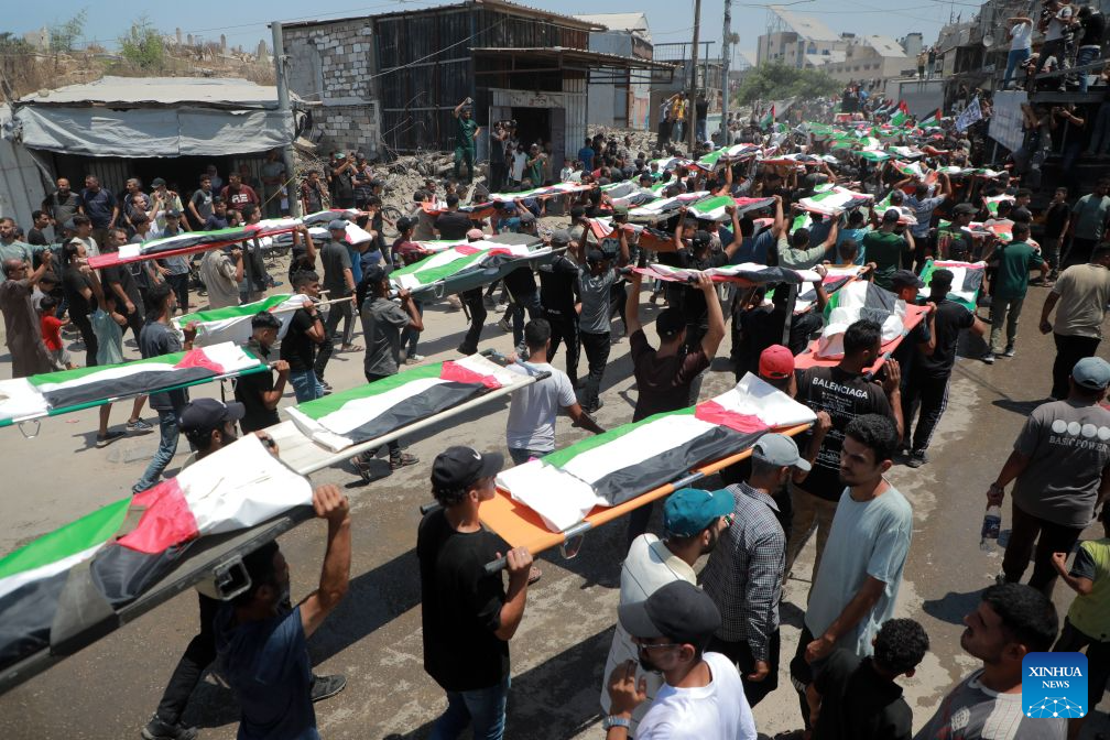 Palestinians attend the mass funeral of 112 victims in Gaza City on Aug. 4, 2026.
The funeral came after the remains of the victims were recently recovered from beneath the rubble of houses destroyed in an Israeli airstrike in November 2023. (Photo by Rizek Abdeljawad/Xinhua)