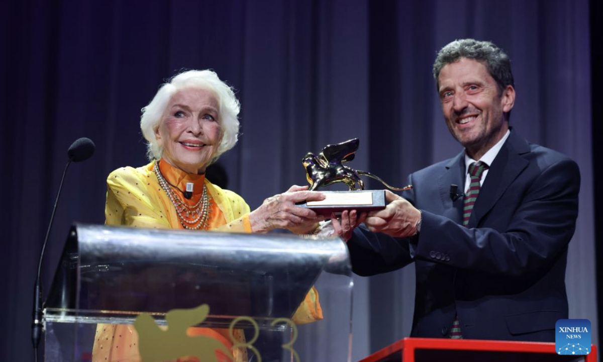 Actress Ellen Burstyn (L) receives the trophy of the Golden Lion for Lifetime Achievement at the 83rd Venice International Film Festival in Venice, Italy, Sept. 7, 2026. (Xinhua/Wang Kaiyan)