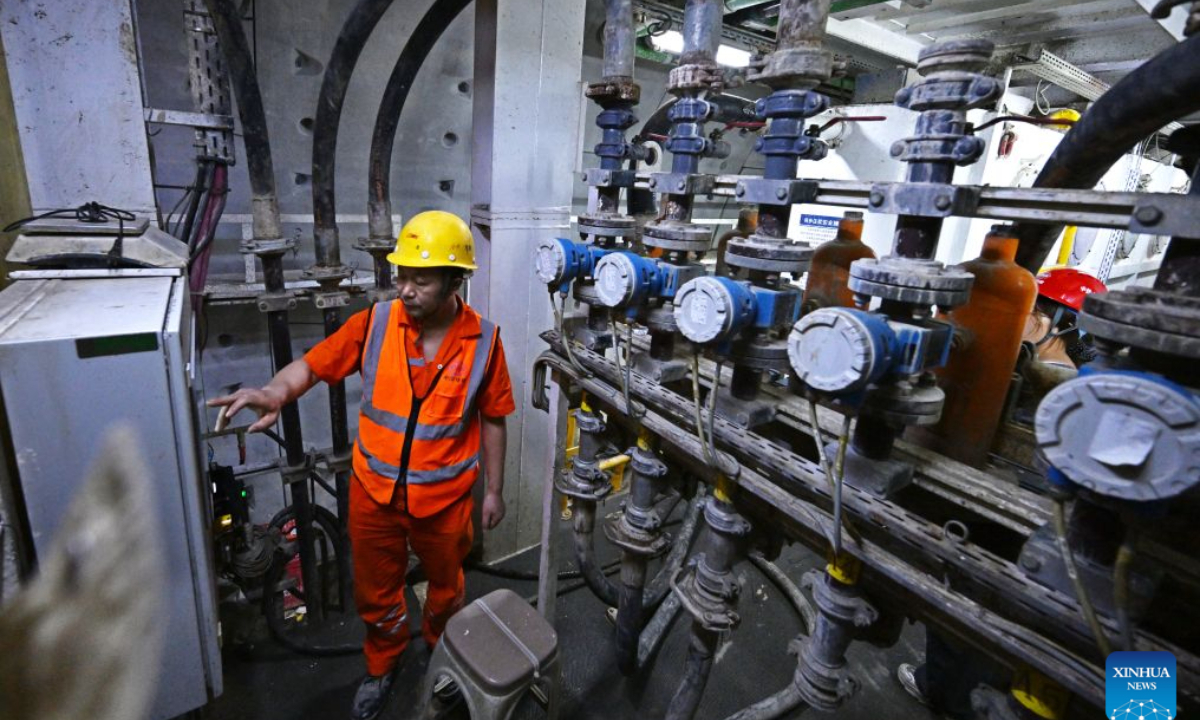 Constructors make a safety inspection at the construction site of Qingdao Jiaozhou Bay Second Tunnel in Qingdao, east China's Shandong Province, Oct. 2, 2026. China's longest undersea highway tunnel completed all shield-driven excavation work on Friday as a shield machine reached its designated position at a depth of 105 meters beneath the sea surface in Jiaozhou Bay, eastern China's Shandong Province, according to China Railway Construction Corporation Limited.
The Qingdao Jiaozhou Bay Second Tunnel will connect Qingdao's main urban area with the Qingdao West Coast New Area. The latter is a national-level new area. The 17.48-km project includes a 14.37-km main tunnel section, featuring two main tunnels and a middle service tunnel, with three lanes in each direction and a design speed of 80 km per hour. (Xinhua/Li Ziheng)