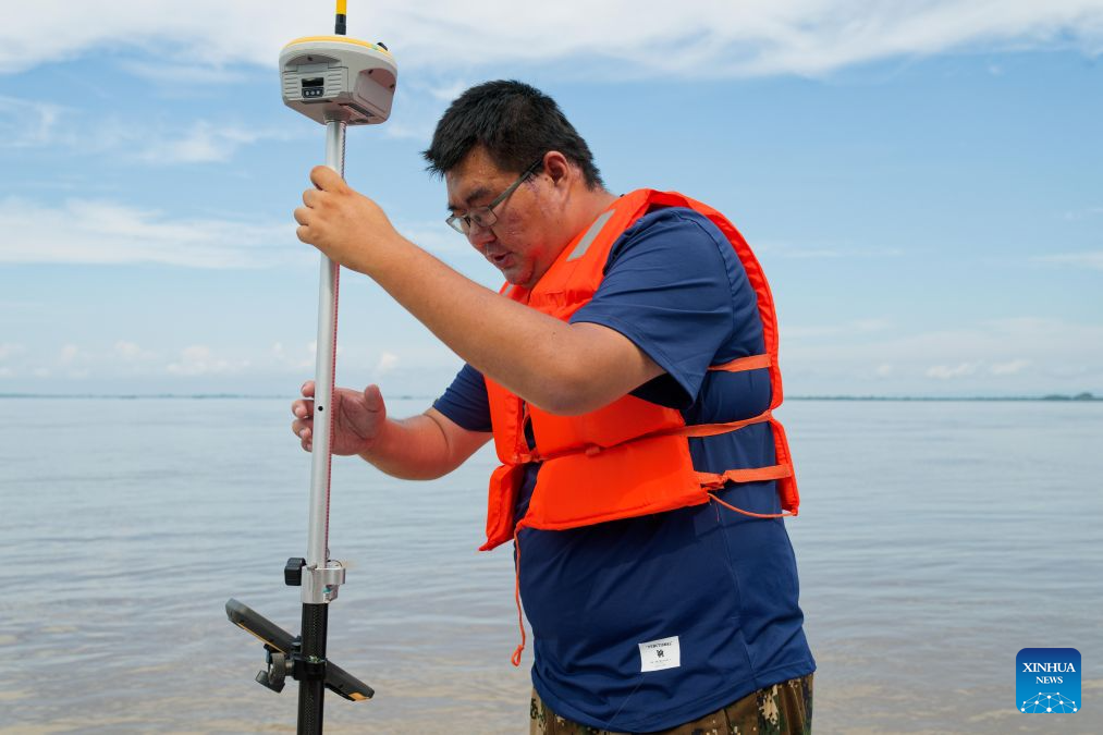 A staff member from the Tongjiang water authority measures water level on a dike in flood-affected Tongjiang City, northeast China's Heilongjiang Province, Aug. 6, 2026. Flood prevention measures have been implemented across northeast China's Heilongjiang Province, which has entered its main flood season.

China has earmarked 50 million yuan (about 7.36 million U.S. dollars) in central government funds to support post-disaster recovery in flood-hit Heilongjiang Province in the northeast, the National Development and Reform Commission (NDRC) said Tuesday. (Xinhua/Zhang Tao)