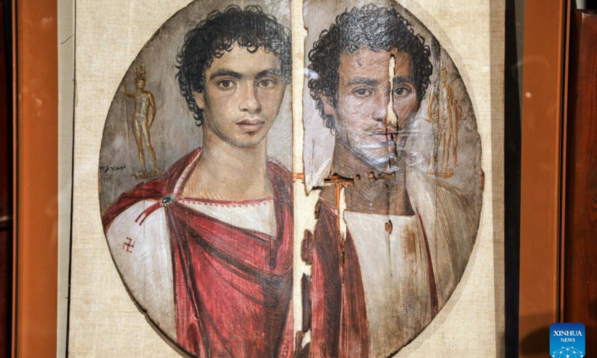 Photo taken on Oct. 11, 2026 shows the Tondo of the Two Brothers, an ancient Egyptian portrait from the Roman period, which will be displayed at Rome's Ara Pacis Museum, at a press conference in Cairo, Egypt. Egypt has restored the Tondo of the Two Brothers, an ancient Egyptian portrait from the Roman period that will be displayed outside the country for the first time, Egyptian Minister of Tourism and Antiquities Sherif Fathy announced Sunday. Fathy made the announcement at a press conference at the Egyptian Museum in Tahrir, Cairo, where the restored masterpiece was unveiled. It will be displayed at Rome's Ara Pacis Museum as part of the exhibition The Power of the Portrait: Egypt and Rome, Faces of Fayum, running from Nov. 5, 2026, to May 2, 2027. (Xinhua/Ahmed Gomaa)