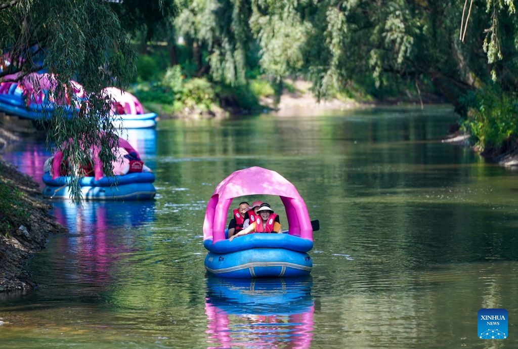 Tourists from southwest China's Sichuan Province enjoy rafting in Xunlong Village, Sayu Town, Zhaoyang District, Zhaotong City, southwest China's Yunnan Province, Aug. 13, 2026. In recent years, Zhaoyang District in Zhaotong City has leveraged its cool and pleasant climate to boost the in-depth sojourn tourism experience as a summer retreat.

The local government has introduced special support policies for summer retreat tourism, optimizing services including dining, lodging, transportation, sightseeing, shopping, and entertainment. (Xinhua/Chen Xinbo)