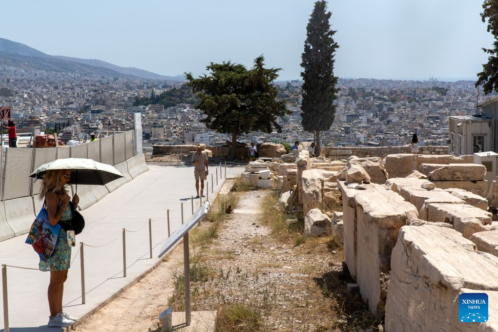 People visit the Acropolis during a heatwave in Athens, Greece, Aug. 25, 2026. (Xinhua/Marios Lolos)