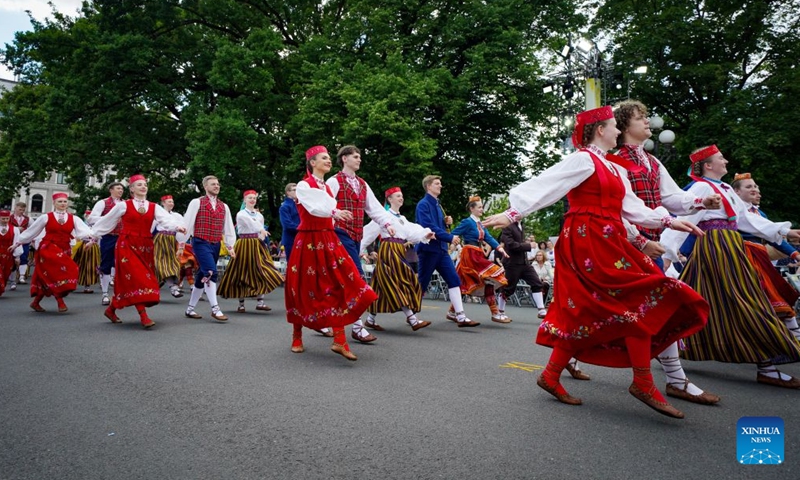 Participants in traditional costumes attend a parade of the Gaudeamus Baltic Student Song and Dance Festival in Riga, Latvia, June 21, 2026. Thousands of university students from Latvia, Lithuania, and Estonia gathered in the Latvian capital to participate in Gaudeamus, the milestone cultural event, celebrating youth and Baltic traditions. (Photo by Edijs Palens/Xinhua)
