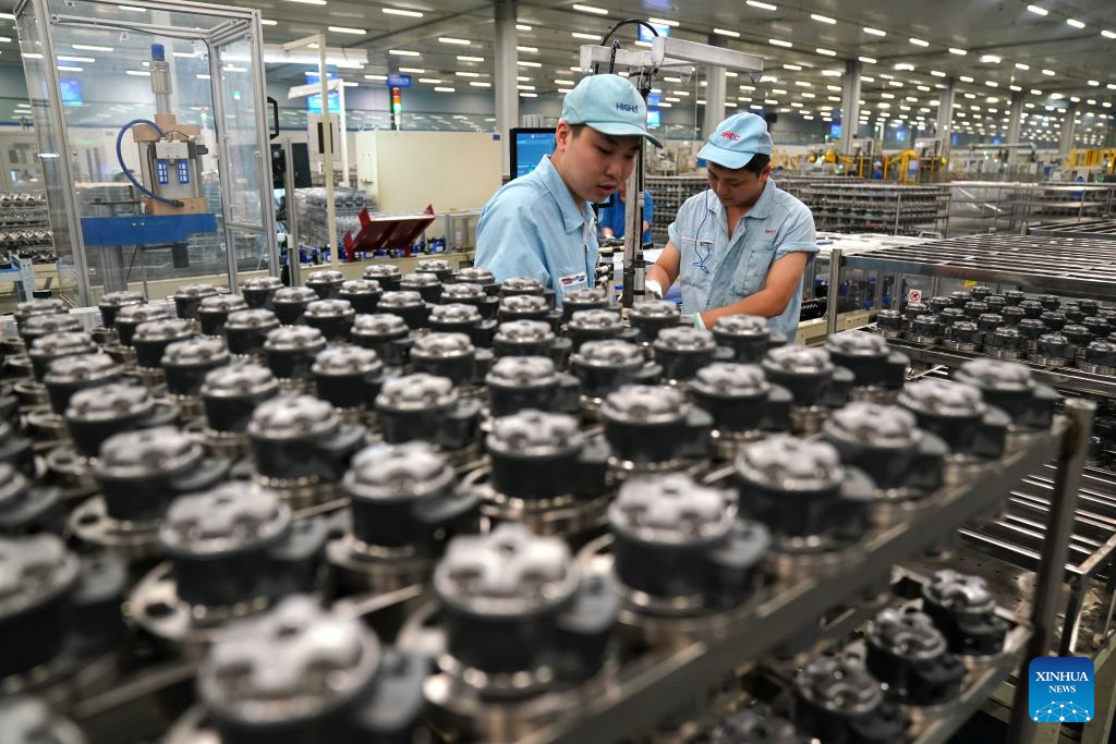 Workers produce air conditioner compressor parts at Highly Group's production base in Nanchang, east China's Jiangxi Province, Aug. 20, 2026. Smart, digitalized production has been fully realized at the Nanchang production base of electric appliance manufacturer Highly Group, a leading intelligent manufacturing base for air conditioner compressors. On average, the base produces a compressor every 6.5 seconds. Highly Group exports air conditioner compressors to 165 countries and regions worldwide, accounting for nearly one-seventh of the global market share. (Xinhua/Wan Xiang)