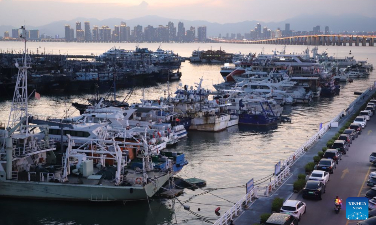This photo taken on July 9, 2026 shows vessels taking shelter at a port in response to the incoming Typhoon Bavi in Xiamen, southeast China's Fujian Province. China's State Flood Control and Drought Relief Headquarters on Thursday upgraded its emergency response for flood and typhoon control from Level IV to Level III in response to Typhoon Bavi. (Photo by Zeng Demeng/Xinhua)