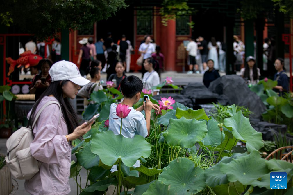 People visit a goldfish exhibition at the Prince Kung's Palace Museum in Beijing, capital of China, Aug. 11, 2026. The museum opened its fifth goldfish exhibition on Tuesday. (Xinhua)
