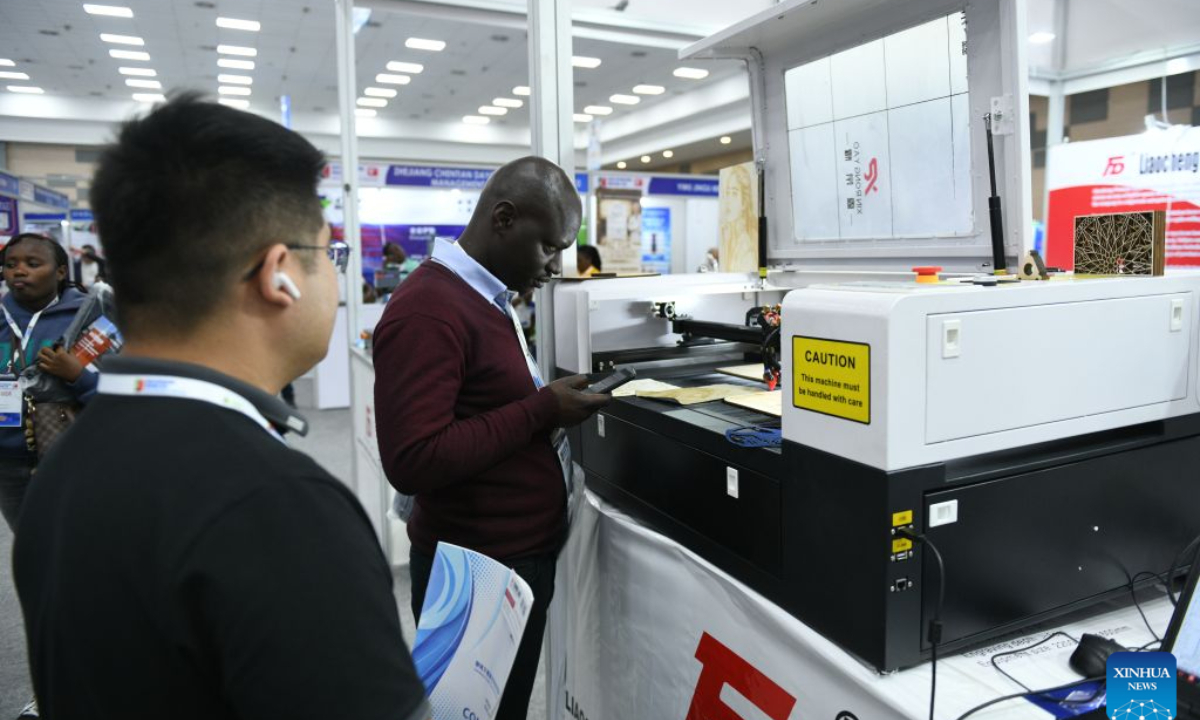 A visitor looks at a laser-engraving machine exhibited by a Chinese enterprise at the 9th Kenya International Industrial Expo in Nairobi, Kenya, Sept. 3, 2026. (Xinhua/Liu Qiong)