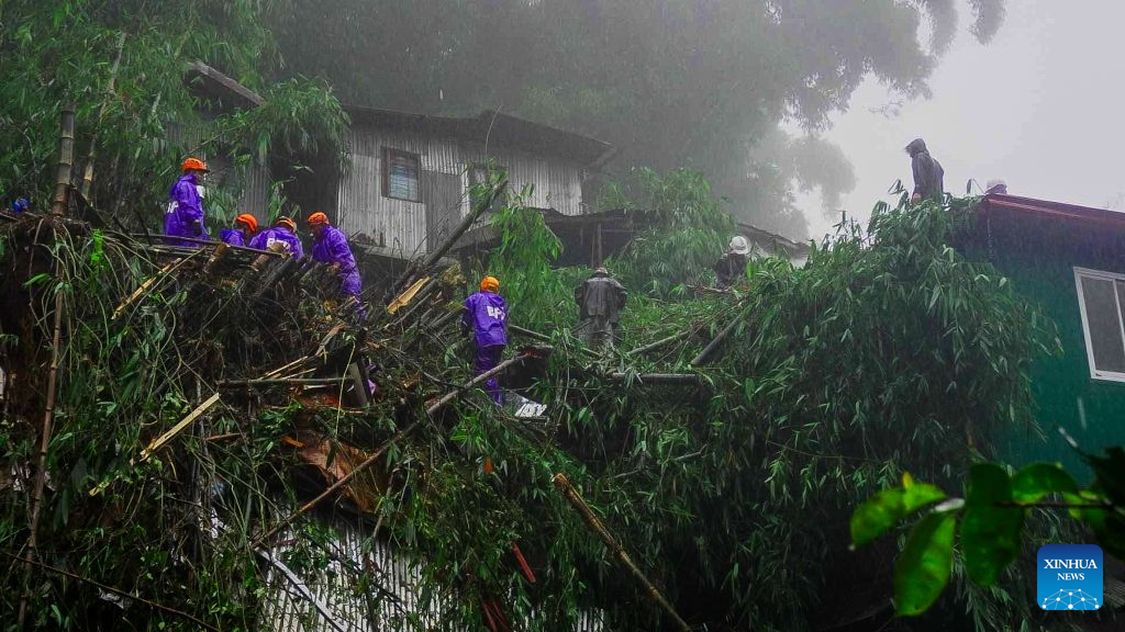 Rescuers conduct search and rescue operations at the site of a landslide in Baguio City, the Philippines, Aug. 10, 2026. Four people were killed and six others missing after a landslide buried three houses in Baguio City in northern Philippines, local media reported on Monday. The landslide struck at around 7 p.m. local time Sunday in Riverside, Barangay Guisad Surong, Baguio City, burying 13 people. As of Monday morning, seven had been pulled from the debris, according to the police. (Baguio Public Information Office/Handout via Xinhua)