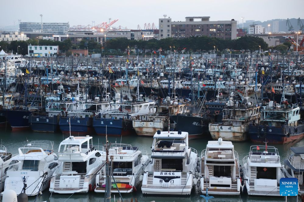 This photo taken on July 9, 2026 shows vessels taking shelter at a port in response to the incoming Typhoon Bavi in Xiamen, southeast China's Fujian Province. China's State Flood Control and Drought Relief Headquarters on Thursday upgraded its emergency response for flood and typhoon control from Level IV to Level III in response to Typhoon Bavi. (Photo by Zeng Demeng/Xinhua)
