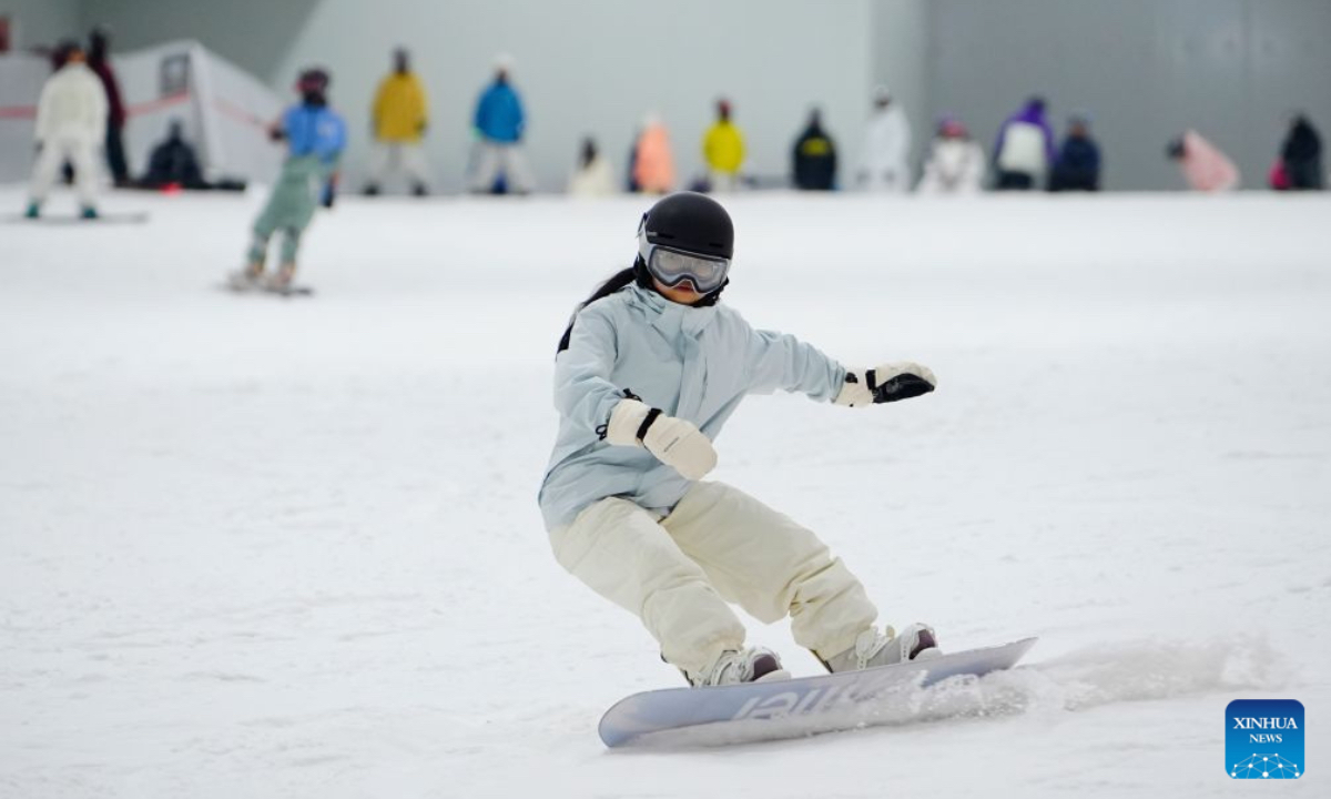 A visitor skis at an indoor ski resort in Shijiazhuang, north China's Hebei Province, July 21, 2026. The city of Shijiazhuang has been focusing on developing its ice-and-snow economy during summers in recent years. A number of indoor ski resorts across the city have rolled out consumption subsidies and hosted professional competitions to develop a heat-relief business model. (Photo by Yan Zhiguo/Xinhua)