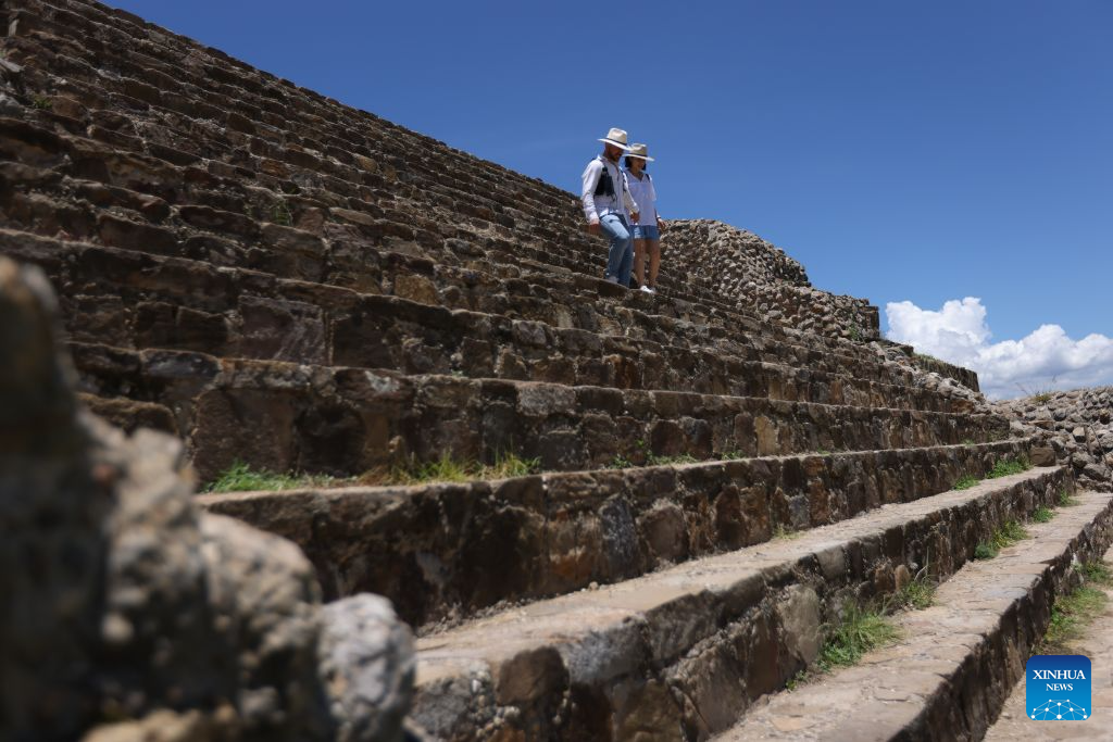Visitors tour the Monte Alban archaeological site in Oaxaca, Mexico, on July 29, 2026. Built around 500 B.C., Monte Alban is located in the southern Mexican state of Oaxaca. It was inscribed on the UNESCO World Heritage List in 1987. (Xinhua/Liu Wenhui)