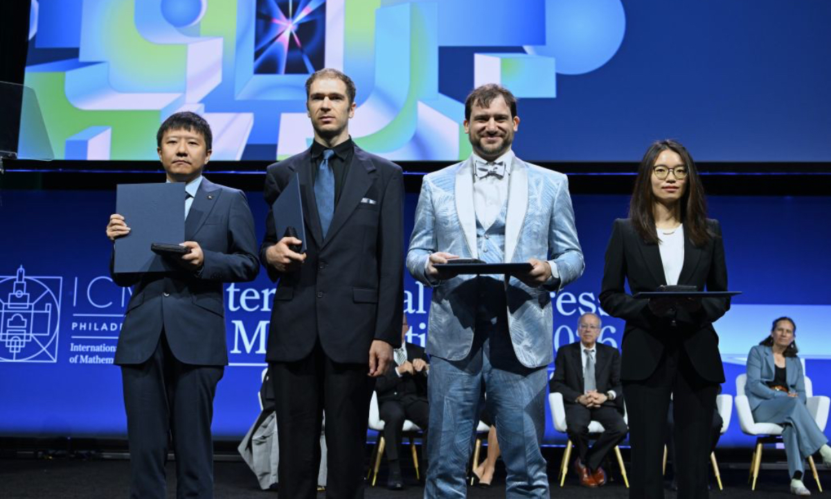 Fields Medalists Deng Yu (1st L) and Wang Hong (1st R), both Chinese mathematicians, John Pardon (2nd L), an American mathematician, and Jacob Tsimerman, a Canadian mathematician, pose for a group photograph at the opening ceremony of the 2026 International Congress of Mathematicians in Philadelphia, the United States, July 23, 2026. Chinese mathematicians Deng Yu and Wang Hong were awarded the Fields Medals at the opening ceremony of the 2026 International Congress of Mathematicians held here on Thursday, marking the first time Chinese mathematicians have won the prestigious honor. The other recipients of the 2026 Fields Medals are American John Pardon and Canada's Jacob Tsimerman. (Xinhua/Li Rui)