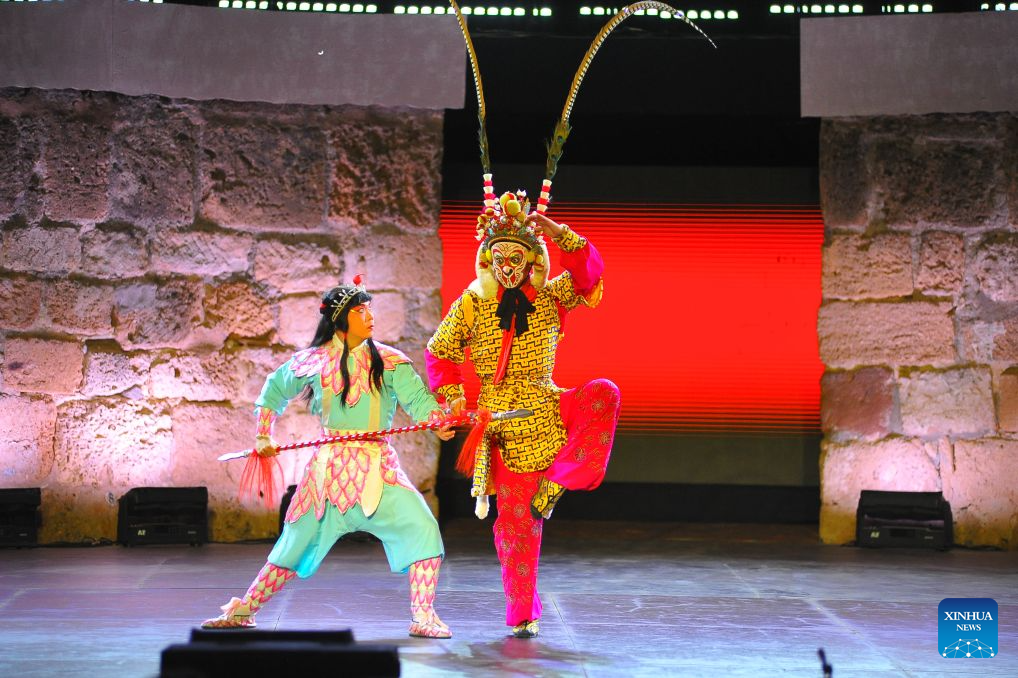 Artists of the China National Peking Opera Company perform at the ancient theatre of Carthage in Tunis, Tunisia, Aug. 11, 2026. The China National Peking Opera Company presented a performance on Tuesday at the Folklores of the World event during the 60th Carthage Festival in Tunis. (Photo by Adel Ezzine/Xinhua)