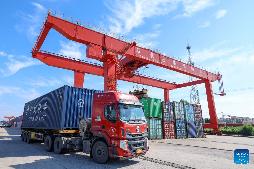 A cargo truck enters the Shijiazhuang international land port in north China's Hebei Province, Aug. 4, 2026. Shijiazhuang international land port in north China's Hebei Province handled a total of 814 China-Europe and China-Central Asia freight train trips in the first half of 2026, up 42.06 percent year on year. (Photo by Liang Zidong/Xinhua)