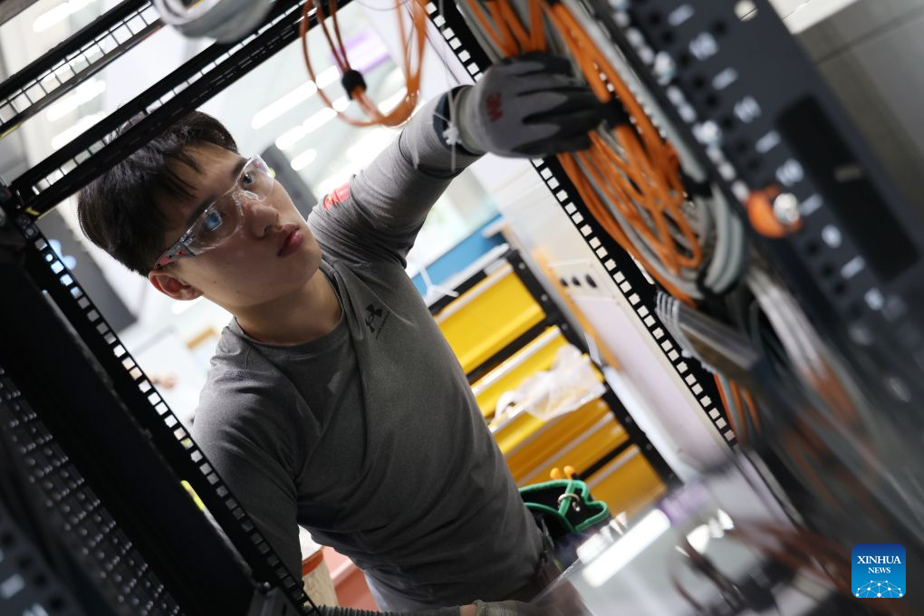 Liu Yuxuan arranges network cables at a training base of Tianjin Electronic Information Technician College for the 48th WorldSkills Competition in Tianjin, north China, Sept. 2, 2026. (Xinhua/Li Ran)
