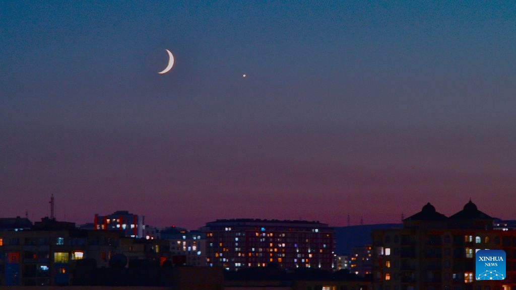 This photo taken on Sept. 14, 2026 shows the planet of Venus next to the moon in the twilight sky over Baku, Azerbaijan. (Xinhua/Chen Junfeng)