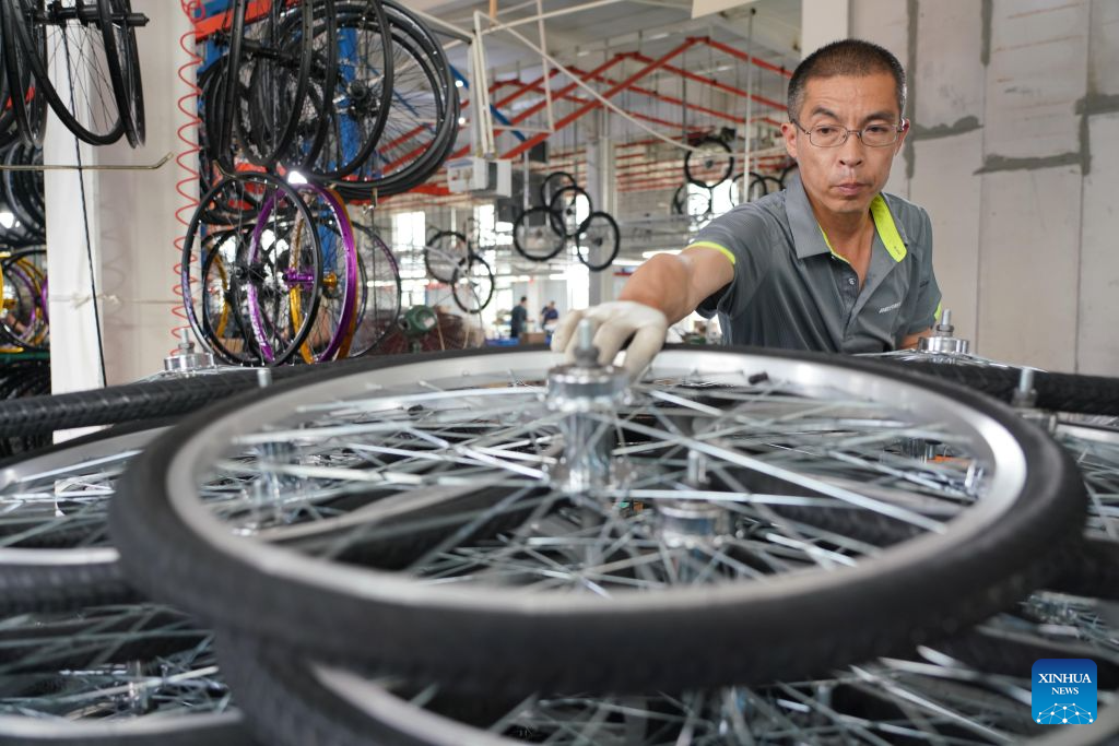 A worker works in a workshop of a bicycle company in Pingxiang County, Xingtai City, north China's Hebei Province, July 22, 2026. Xingtai City is a nationally renowned bicycle manufacturing base, with its products sold worldwide. In recent years, Xingtai has pushed forward the upgrading of the bicycle industry, continuously improved cycling infrastructure, and hosted a wide range of professional cycling races and mass public riding events. By integrating manufacturing and cycling events, the city has fueled accelerated growth of the local bicycle sector. (Photo by Feng Yichao/Xinhua)