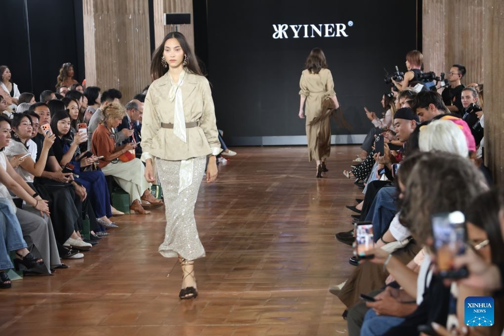 Models present creations of YINER at Shenzhen Futian Fashion Event in Milan, Italy, Sept. 22, 2026. Three Chinese brands Laurèl, IDPAN and YINER held a joint fashion show during the Spring/Summer 2027 Milan Fashion Week on Tuesday. (Photo by Michele Novaga/Xinhua)