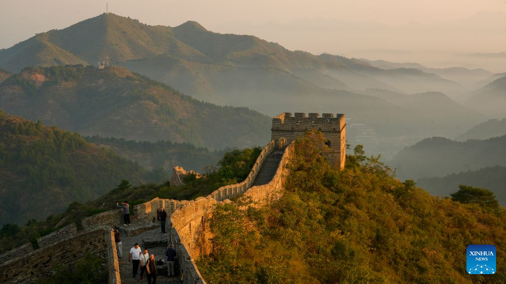 This photo taken on Sept. 17, 2026 shows tourists enjoying the scenery at the Jinshanling section of the Great Wall, Luanping County of Chengde City, north China's Hebei Province. (Photo by Zhou Wanping/Xinhua)