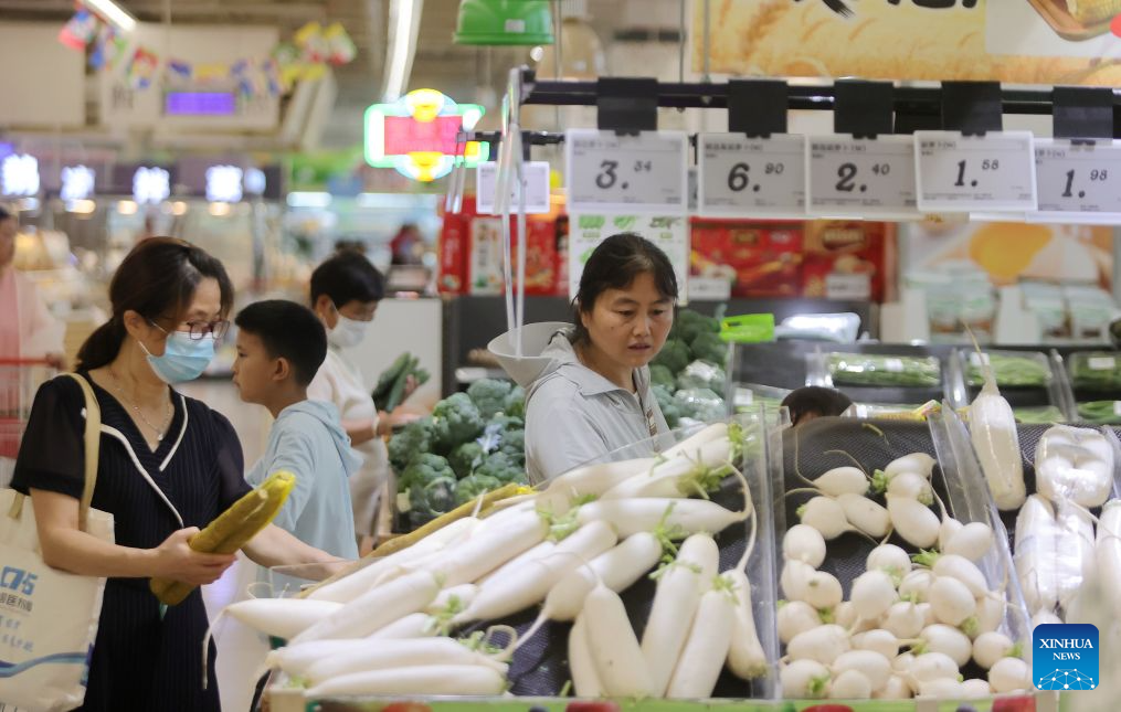 Consumers shop at a supermarket in Yangzhou, east China's Jiangsu Province, July 9, 2026. The consumer price index (CPI), a main gauge of inflation, rose 1 percent year on year in the first six months of 2026, data from the National Bureau of Statistics (NBS) revealed. In June alone, the CPI gained 1 percent year on year and edged down 0.3 percent month on month, with the core CPI, which excludes food and energy prices, increasing by 1 percent year on year, continuing the moderate upward trend. (Photo by Meng Delong/Xinhua)