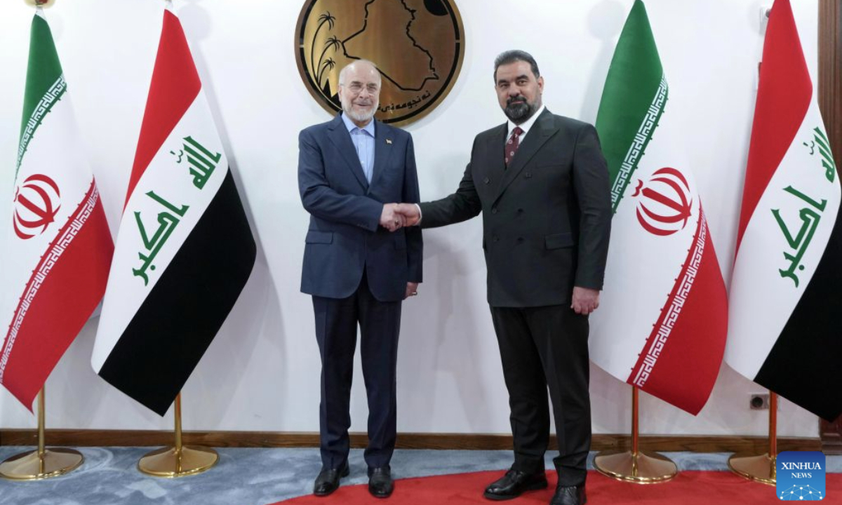 Iraqi Parliament Speaker Haibet al-Halbousi (R) shakes hands with visiting Iranian Parliament Speaker Mohammad Bagher Ghalibaf in Baghdad, Iraq, Aug. 19, 2026. (Media Office of the Speaker of the Iraqi Parliament/Handout via Xinhua)
