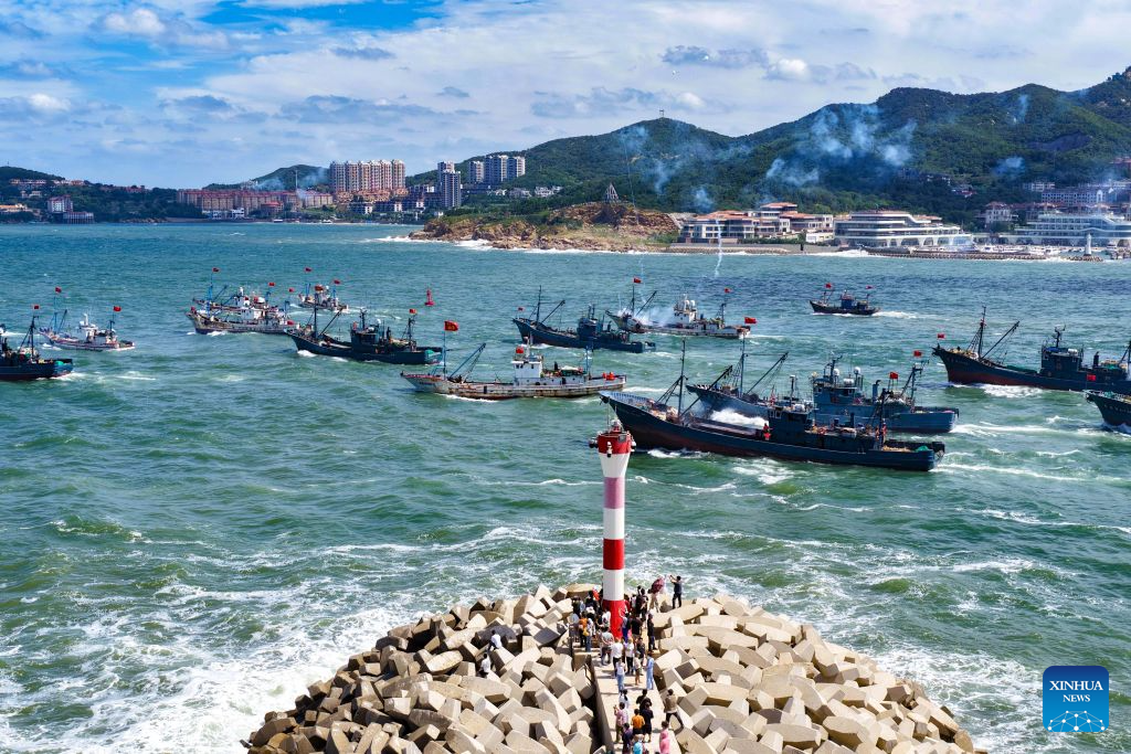 An aerial drone photo taken on Sept. 1, 2026 shows fishing boats heading toward fishing grounds in Weihai, east China's Shandong Province. The new fishing season in the Yellow Sea and Bohai Sea kicked off on Tuesday after a four-month summer fishing moratorium. (Photo by Zhu Chunxiao/Xinhua)
