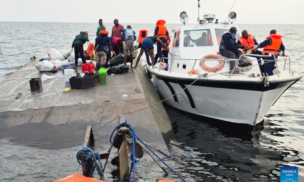Photo taken with a mobile phone shows rescuers conducting search and rescue operations at the site of a boat capsize on Lake Kariba in Mashonaland West Province, Zimbabwe, on August 12, 2026. Zimbabwean President Emmerson Mnangagwa on Wednesday declared a state of disaster following a boat capsize in Lake Kariba, as police confirmed the death toll from the tragedy had risen to 44. (Str/Xinhua)