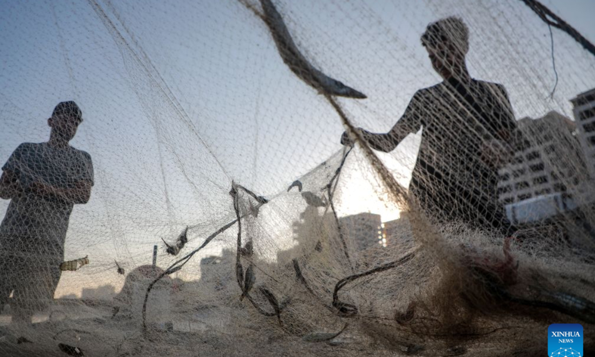 Palestinian fishermen are seen working at Gaza's seaport, in Gaza City, on Sept. 3, 2026. (Photo by Rizek Abdeljawad/Xinhua)