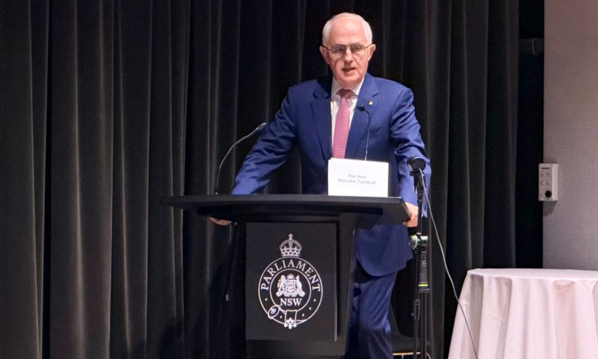 This photo taken with a mobile phone shows former Australian Prime Minister Malcolm Turnbull speaking at a hearing of the AUKUS Public Inquiry at NSW Parliament House in Sydney, Australia, Aug. 10, 2026. (Xinhua/Liu Xiaoyu)