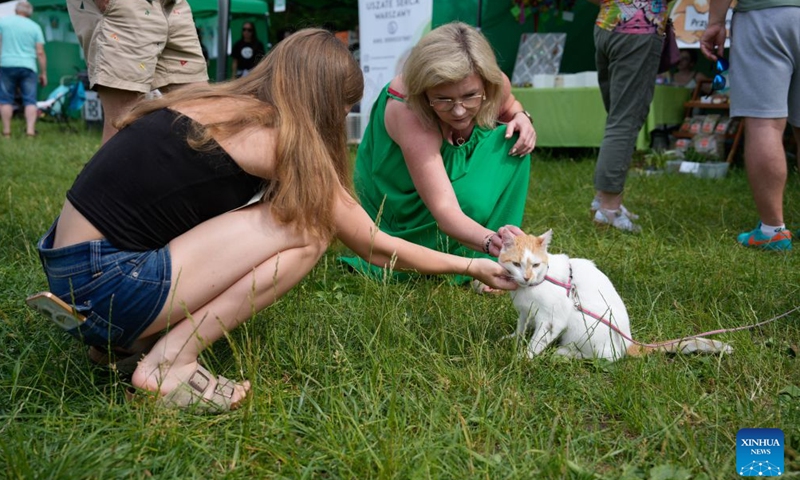 People attend an event marking the Warsaw Animal Day at a park in Warsaw, Poland, June 21, 2026. (Photo by Jaap Arriens/Xinhua)