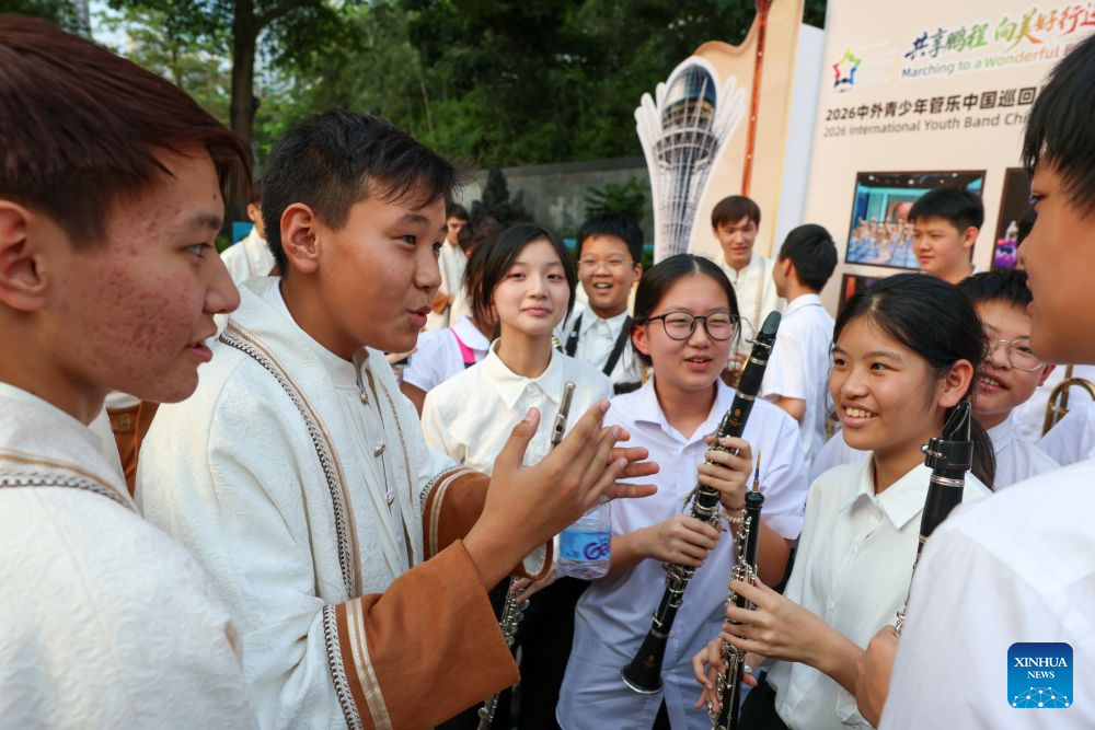 Members of a youth band from Kazakhstan communicate with local students during the 2026 International Youth Band China Tour (Shenzhen) in Shenzhen, south China's Guangdong Province, Sept. 16, 2026. The tour kicked off here on Wednesday. (Xinhua/Mao Siqian)
