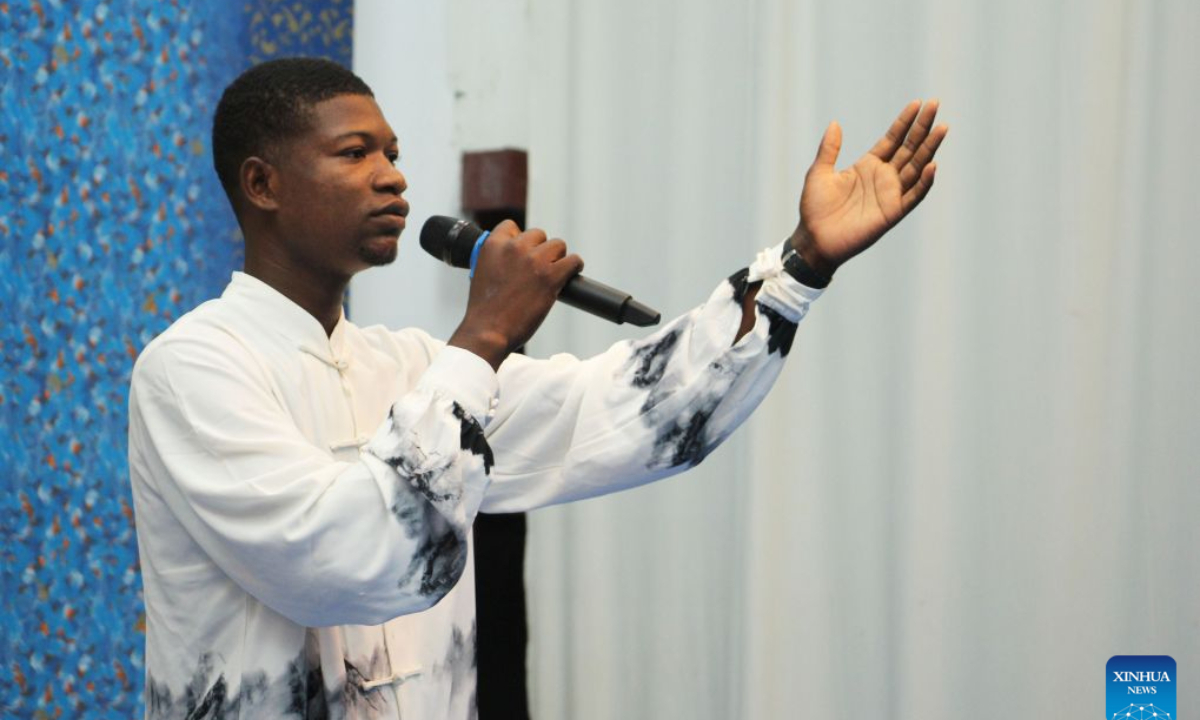 A student from the Confucius Institute of the University of Abomey-Calavi recites poems during a poetry event celebrating the Mid-Autumn Festival in Cotonou, Benin, Sept. 22, 2026. The Chinese Cultural Center in Benin and the Confucius Institute of the University of Abomey-Calavi jointly held the event here on Tuesday. (Photo by Seraphin Zounyekpe/Xinhua)