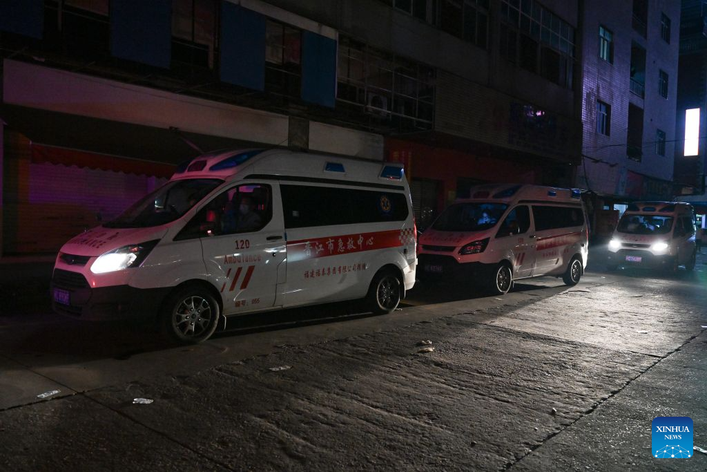 Ambulances are on standby after a fire broke out at a shoe factory in Jiangtou Village, Chendai Township of Jinjiang City, southeast China's Fujian Province, on July 9, 2026. Twenty-eight people have been killed following a fire at a shoe factory in Jinjiang City on Thursday, local authorities said. (Xinhua/Zhou Yi)