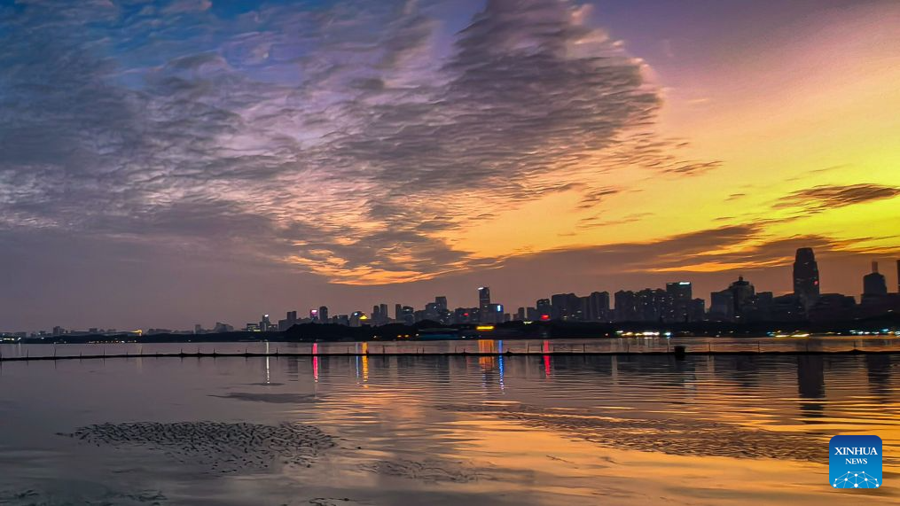 This photo taken with a mobile phone on Sept. 5, 2026 shows the East Lake scenic area at sunset in Wuhan, central China's Hubei Province. (Xinhua/Shen Hongbing)