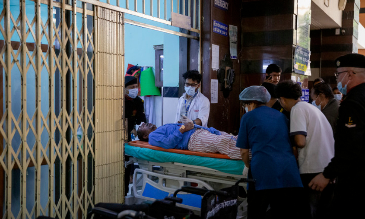 A person injured in a massive flash flood in north Nepal is taken to a hospital in Kathmandu, Nepal, Aug. 26, 2026. At least 95 people were killed and 484 others remain missing in a massive flash flood in north Nepal on Wednesday, the Office of the Prime Minister said. (Photo by Sulav Shrestha/Xinhua)