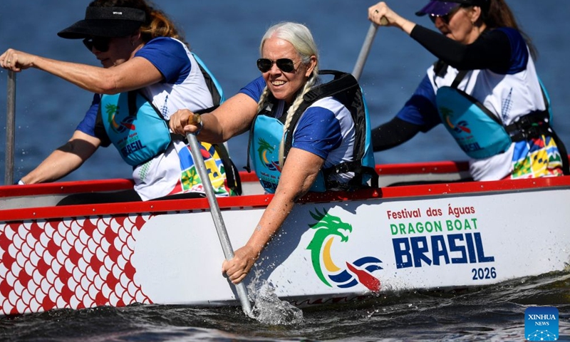 Rowers compete in a dragon boat racing during a cultural event marking the Dragon Boat Festival at Lagoa Rodrigo de Freitas in Rio de Janeiro, Brazil, June 20, 2026. (Photo by Daniel Ramalho/Xinhua)