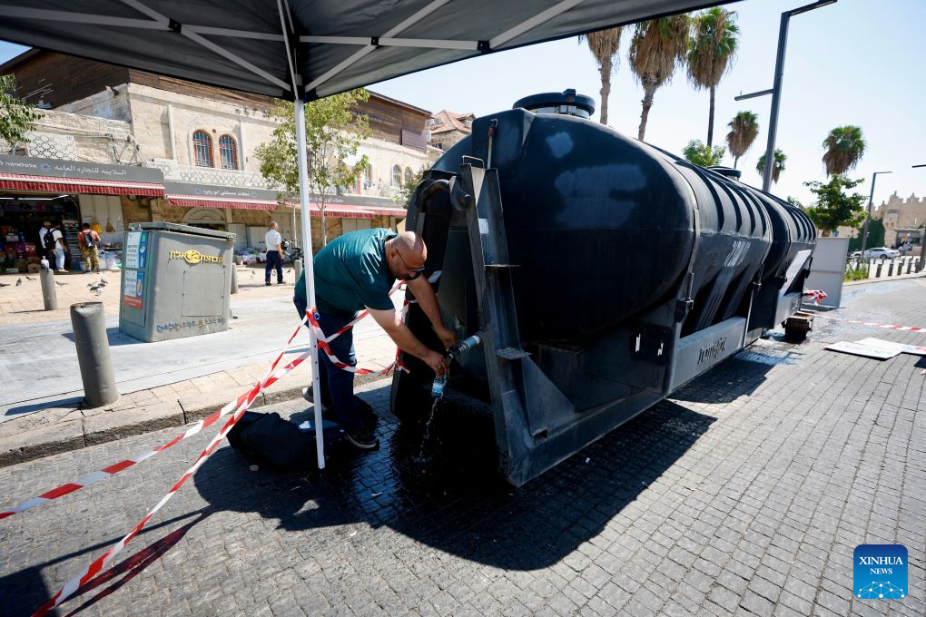 A man fetches water at a water supply point in Jerusalem, Sept. 1, 2026.
Several Jerusalem neighborhoods experienced prolonged water outages, while alternative supplies and public water taps were provided. (Photo by Jamal Awad/Xinhua)